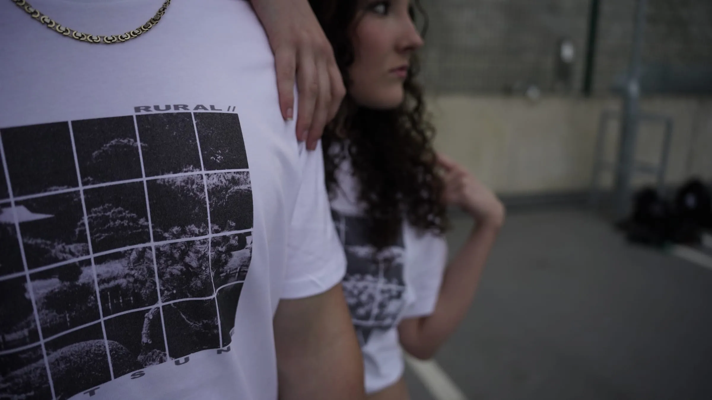 The print in the foreground, a second model looking away behind.